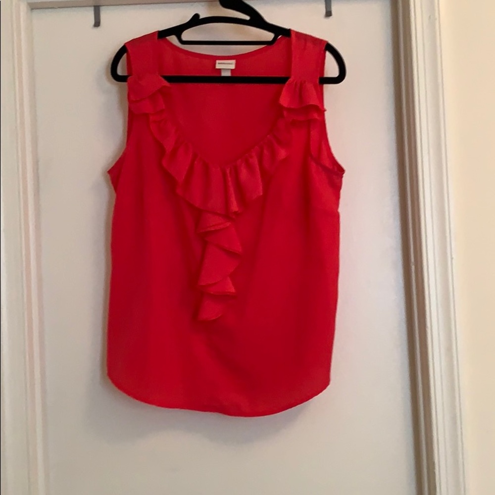 Pink tank top with ruffle detail around neckline
